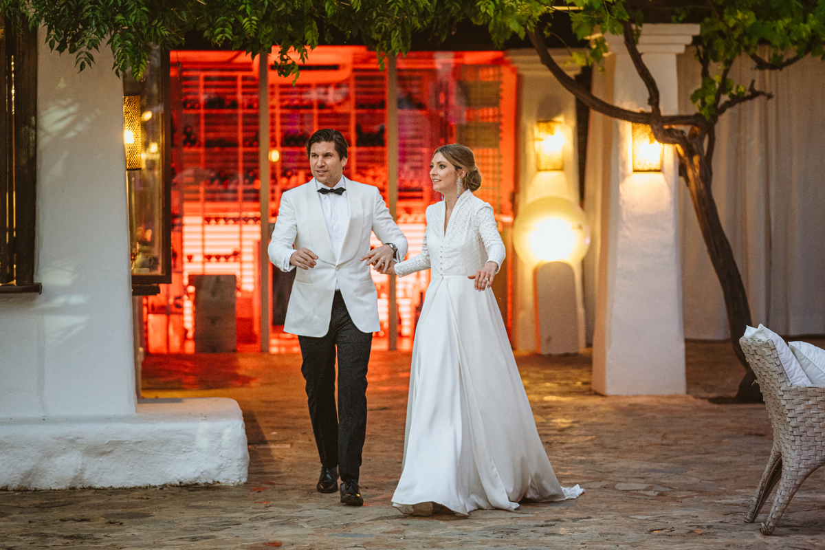 Go behind the scenes at Antonia & Birger's luxury, ultra-romantic Atzaro Ibiza wedding with a ceremony beside the water and epic party after dark.