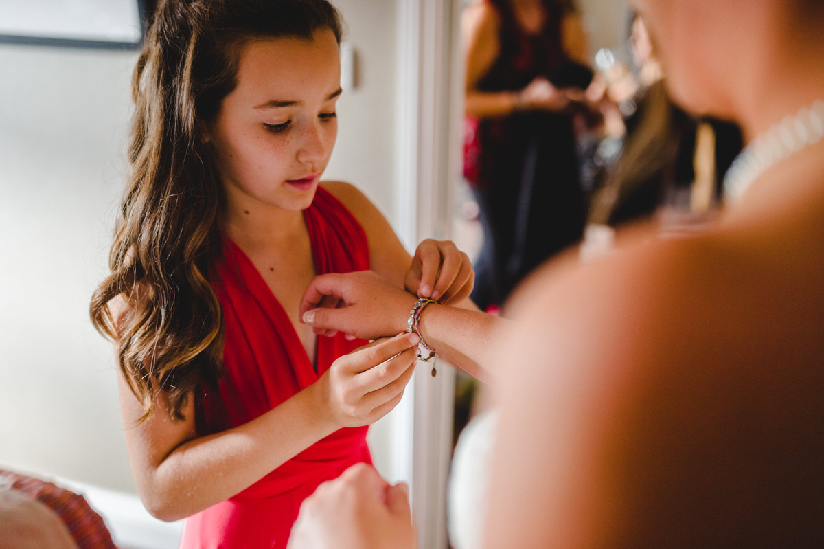 bridesmaid putting on her gift
