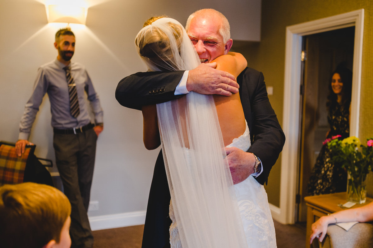 father hugs his daughter
