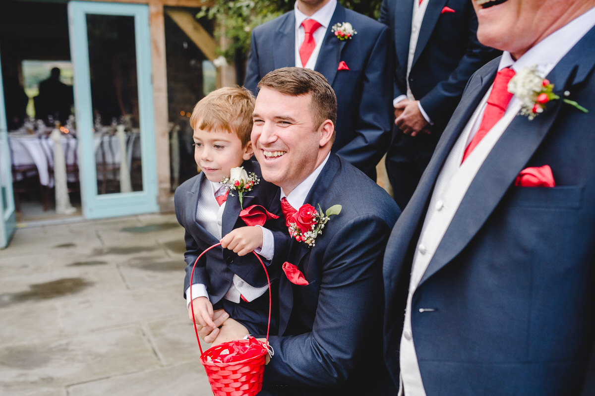 father and son throwing rose petals
