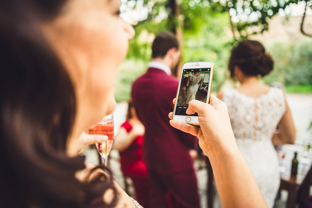 guest taking picture of dress