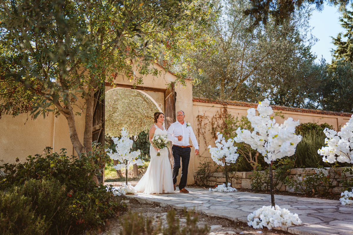 Discover how Ellie and Jack's ethereal, romantic Cyprus wedding unfolded, captured magically moment by moment by us, their Minthis Hills wedding photographer.
